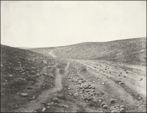 Roger Fenton's Valley of the Shadow of Death with canon balls in roadway
