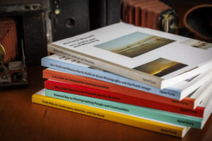 Photo showing books in the Aperture Workshop series.